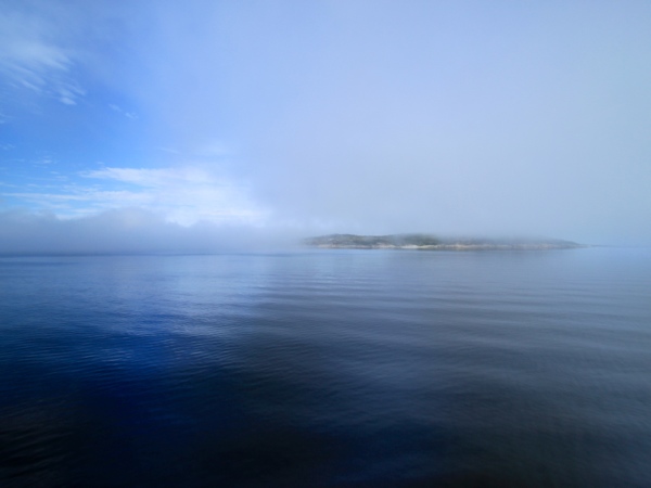 Watching as the clouds start to move and burn away.